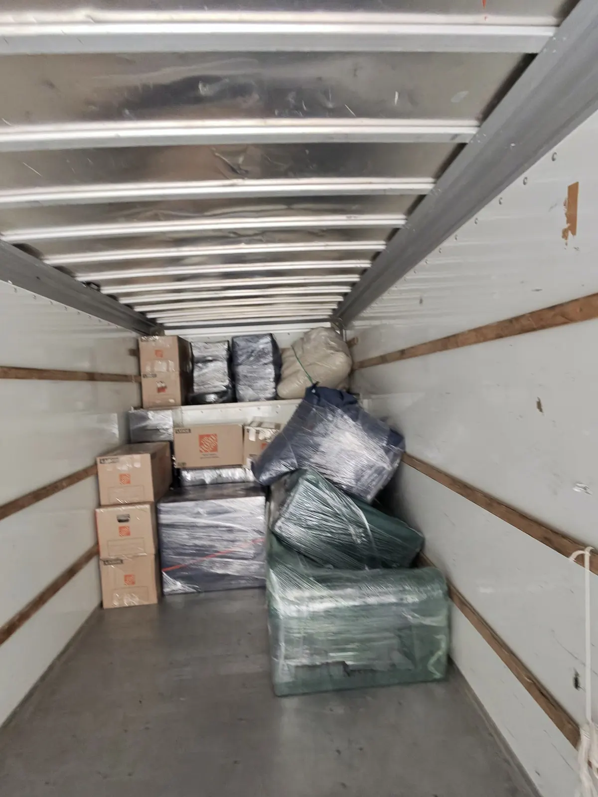 Boxes and wrapped furniture loaded inside a moving truck in Avon.